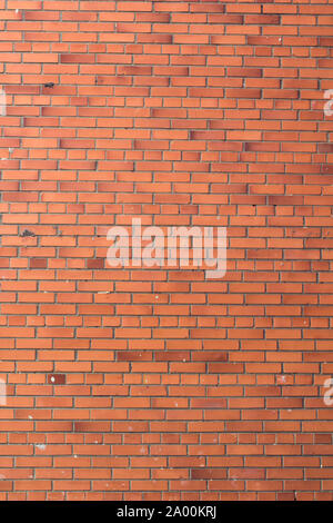 Vertical red bricks background. A part of wall of the building Stock Photo