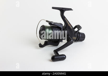 Shimano Aero 3500 baitrunner fixed spool fishing reel with a light  breaking-strain fishing line on the spool. White background Stock Photo -  Alamy