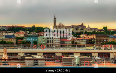 Budapest, Hungary, Aug 2019, view of the top deck of a Viking River Cruises boat on the Danube opposite the Fisherman's Bastion and the Matthias Church Stock Photo
