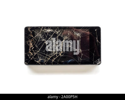 Top view of broken touch screen smart phone isolated on white background Stock Photo