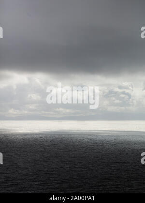 Neist Point Lighthouse, looking out over the Atlantic Ocean towards the outer hebrides Stock Photo