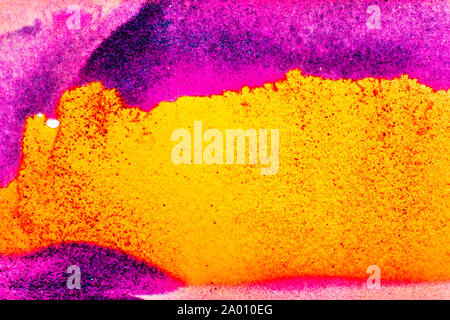 Colorful sand pigments falling down in water. Abstract landscape background. Stock Photo