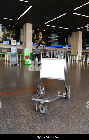 Empty airport trolley with a blank advertising space. Stock Photo