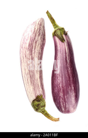Two eggplants graffiti isolated over white background. The outer skin is striped with violet with ivory white. Top view. Stock Photo