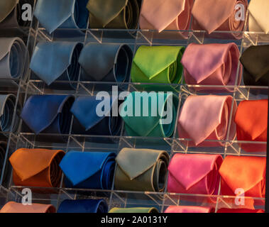different colors silk tie on display stand Stock Photo