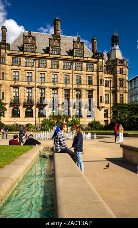 UK, Yorkshire, Sheffield, Peace Gardens, visitors at Town Hall in sunshine Stock Photo