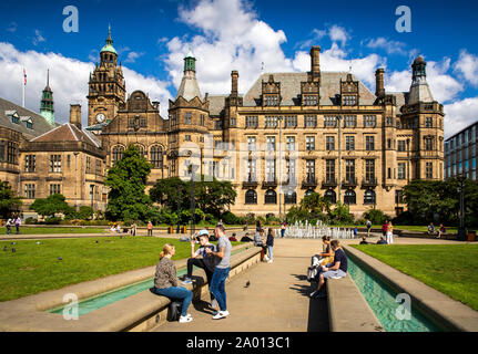 UK, Yorkshire, Sheffield, Peace Gardens, visitors at Town Hall in sunshine Stock Photo