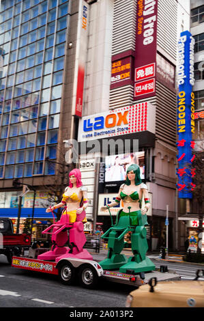 Robots on a flatbed truck in the streets of Tokyo, Japan. Stock Photo