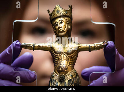 Curator of archeology at York Museums Trust Lucy Creighton with a rare 800-year-old figure of Christ, that has returned home to the York for the first time in nearly two centuries. The gilded and enamelled ornament, which was made in Limoges, France in the 13th Century, was found in the ruins of St Mary's Abbey York in 1826, and is being returned to York for display at the Yorkshire museum.