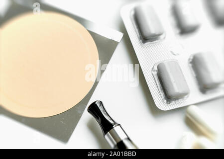 nicotine patch, chewin gum and ecigarette used for smoking cessation isolated on white background Stock Photo