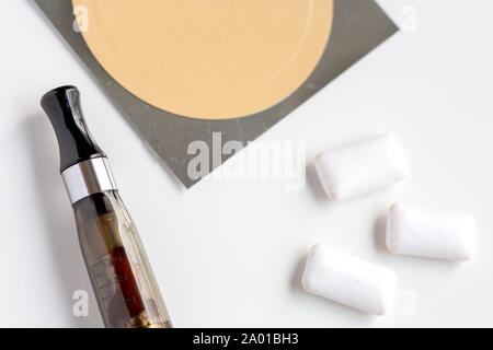 nicotine patch, chewin gum and ecigarette used for smoking cessation isolated on white background Stock Photo