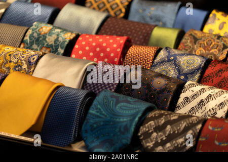 different colors silk tie on display stand Stock Photo