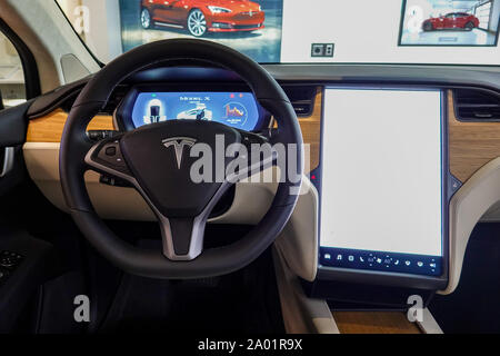 Seattle,WA/USA-9/15/29: A Tesla Car   dashboard and steering wheel.  Tesla, Inc. is an American automotive and energy company that specializes in elec Stock Photo