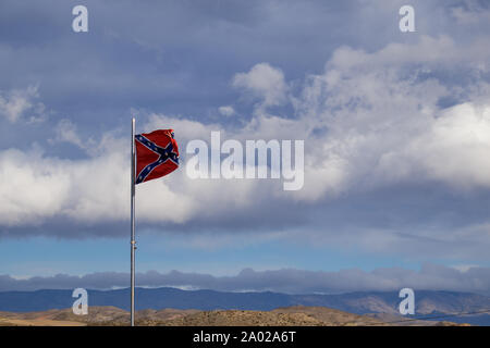 Confederate flag flutters on the wind Stock Photo