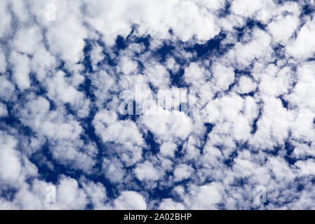 Small clouds in blue sky Stock Photo