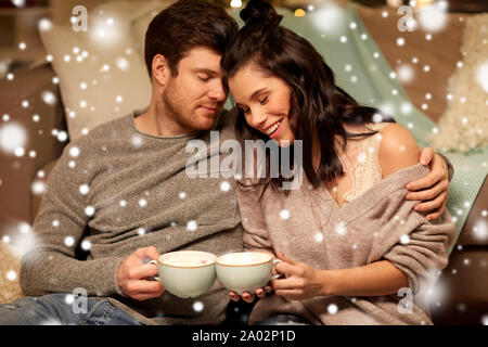 happy couple drinking hot chocolate on christmas Stock Photo