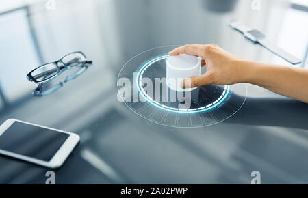 hand with control knob on interactive panel Stock Photo