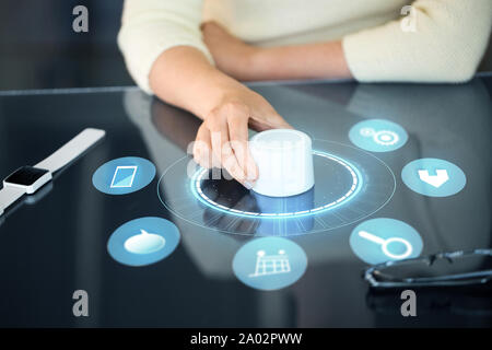woman with control knob on interactive panel Stock Photo