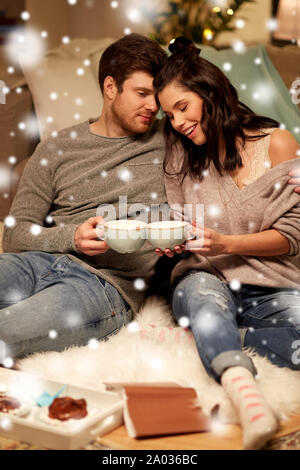 happy couple drinking hot chocolate on christmas Stock Photo