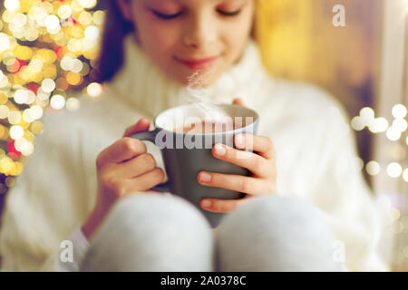 close up of girl with hot chocolate on christmas Stock Photo