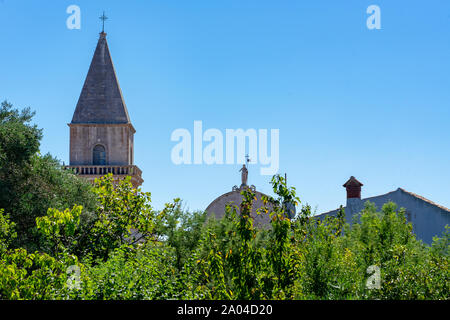 Beautiful historical old town Osor skyline over trees on Cres island Stock Photo