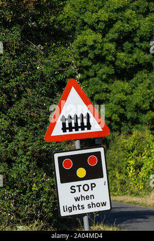 Level crossing warning sign on rural road Stock Photo
