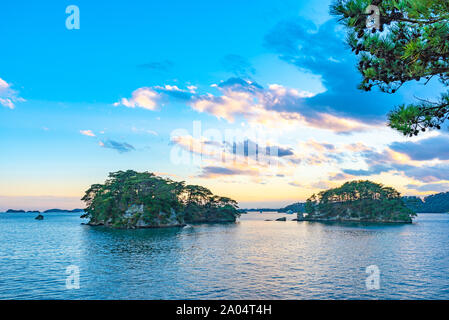 Matsushima Bay in dusk, beautiful islands covered with pine trees and rocks. One of the Three Views of Japan Stock Photo