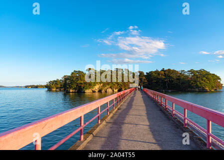 Fukuura Island with Fukuura Bridge in the famous Matsushima Bay. Beautiful islands covered with pine trees and rocks. One of the Three Views of Japan. Stock Photo