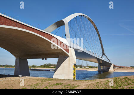 Bowstring arched bridge called De Oversteek which spans the river Waal at Nijmegen Stock Photo