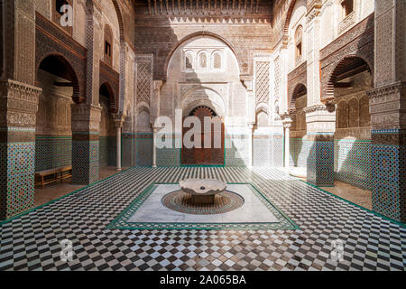 The Al-Attarine Madrasa is a madrasa in Fes, Morocco, near the Al-Qarawiyyin. It was built by the Marinid sultan Uthman II Abu Said in 1323-5 Stock Photo