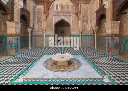 The Al-Attarine Madrasa is a madrasa in Fes, Morocco, near the Al-Qarawiyyin. It was built by the Marinid sultan Uthman II Abu Said in 1323-5 Stock Photo