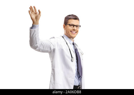 Young male doctor waving isolated on white background Stock Photo