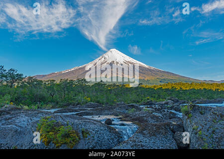 Sunrise by the Osorno volcano with the Petrohue waterfalls and river in the foreground, Lake district, near Puerto Varas and Puerto Montt, Chile. Stock Photo