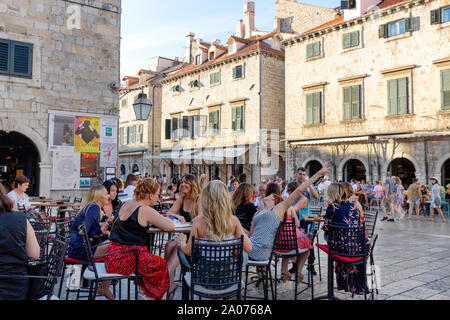 Dubrovnik tourists - group of women tourists on holiday at a cafe in Stradun, the main street, Dubrovnik old town, Dubrovnik Croatia Europe
