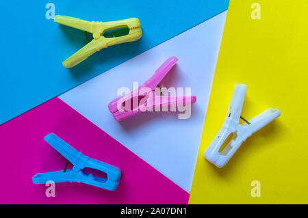 Colored clothespins on a colorful background. Stock Photo