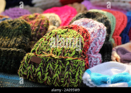 Heap of colorful trendy knitted hats Stock Photo