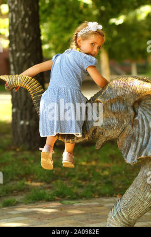 Portrait of a three year old girl on the summer playground Stock Photo