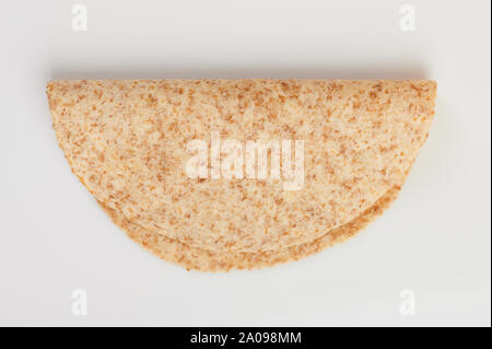 One folded tortilla  above view isolated on white background Stock Photo