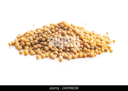 Yellow mustard seeds isolated on white background. Stock Photo
