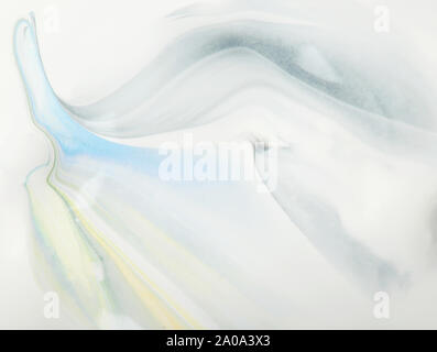 Colorful paint lines on white oil background close up view Stock Photo