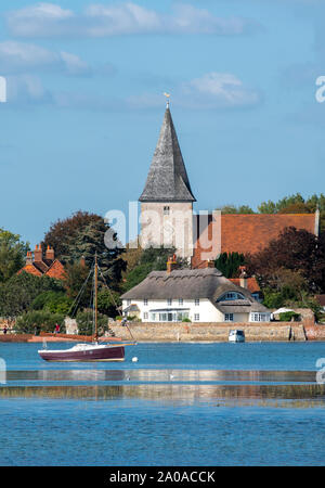 High tide in the picturesque village of Bosham showing the Holy Trinity Church,  Chichester Harbour, West Sussex, England, UK Stock Photo