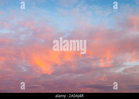 Beautiful colors of dramatic sunset sky and clouds with dramatic golden light Stock Photo