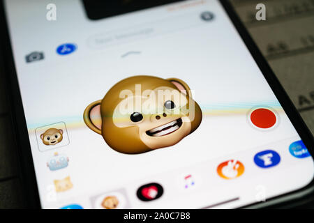 Paris, France - Sep 12, 2019: Latest iPhone 11 Pro featuring multiple Animoji character with face of monkey expressing smiling face sentiments Stock Photo