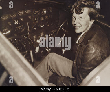 Amelia Earhart in the cockpit of her Lockheed Model 10-E Electra aircraft Stock Photo