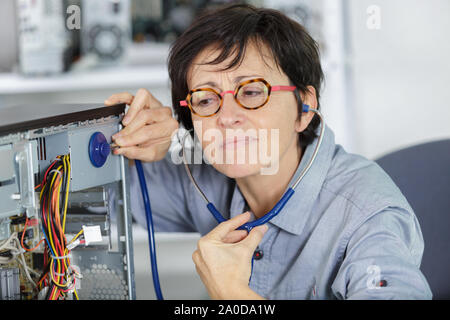 a woman uses a stetheoscope Stock Photo