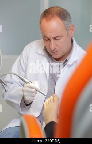 podiatry doctor treating patients foot Stock Photo