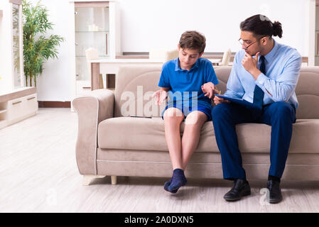 The internet addicted boy visiting male doctor Stock Photo