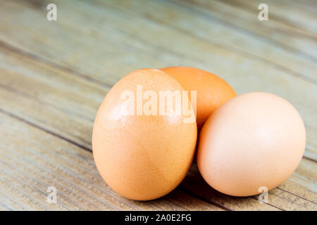 Three Eggs on a Wooden Background Stock Photo