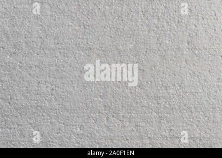 Closeup detail view of white abstract polystyrene foam texture background. Plastic sheet, styrofoam, polystyrene abstract synthetic packaging material Stock Photo