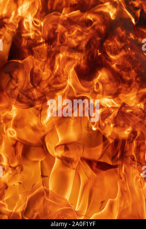 Abstract fiery background of red, yellow and orange flames of a bonfire ...